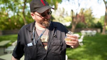 Attendee examining beer